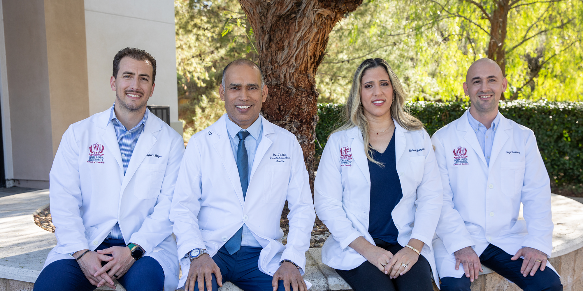 all four doctors of Redlands Family Dental Care outside smiling
