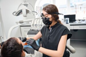 Dr. Tadha consulting with a patient in a modern dental office